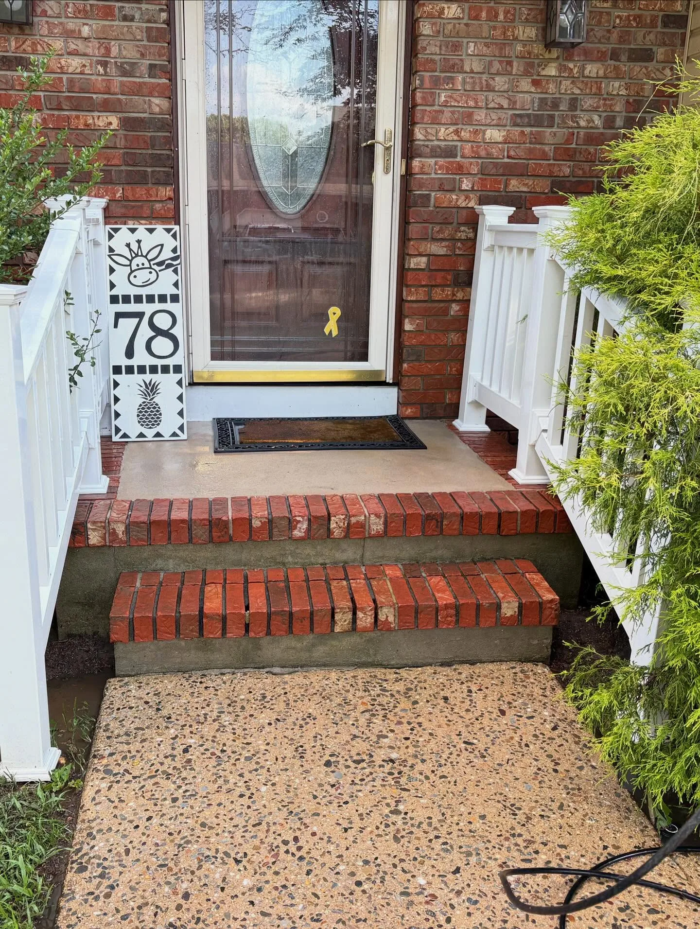 Clean porch and brick steps after professional pressure washing